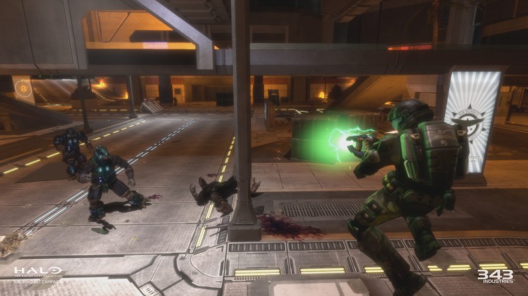 In-game screenshot from Halo 3: ODST. An "orbital drop shock trooper" is charging up a plasma pistol to fire at an Elite grunt.